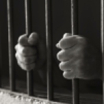 Hands holding the bars